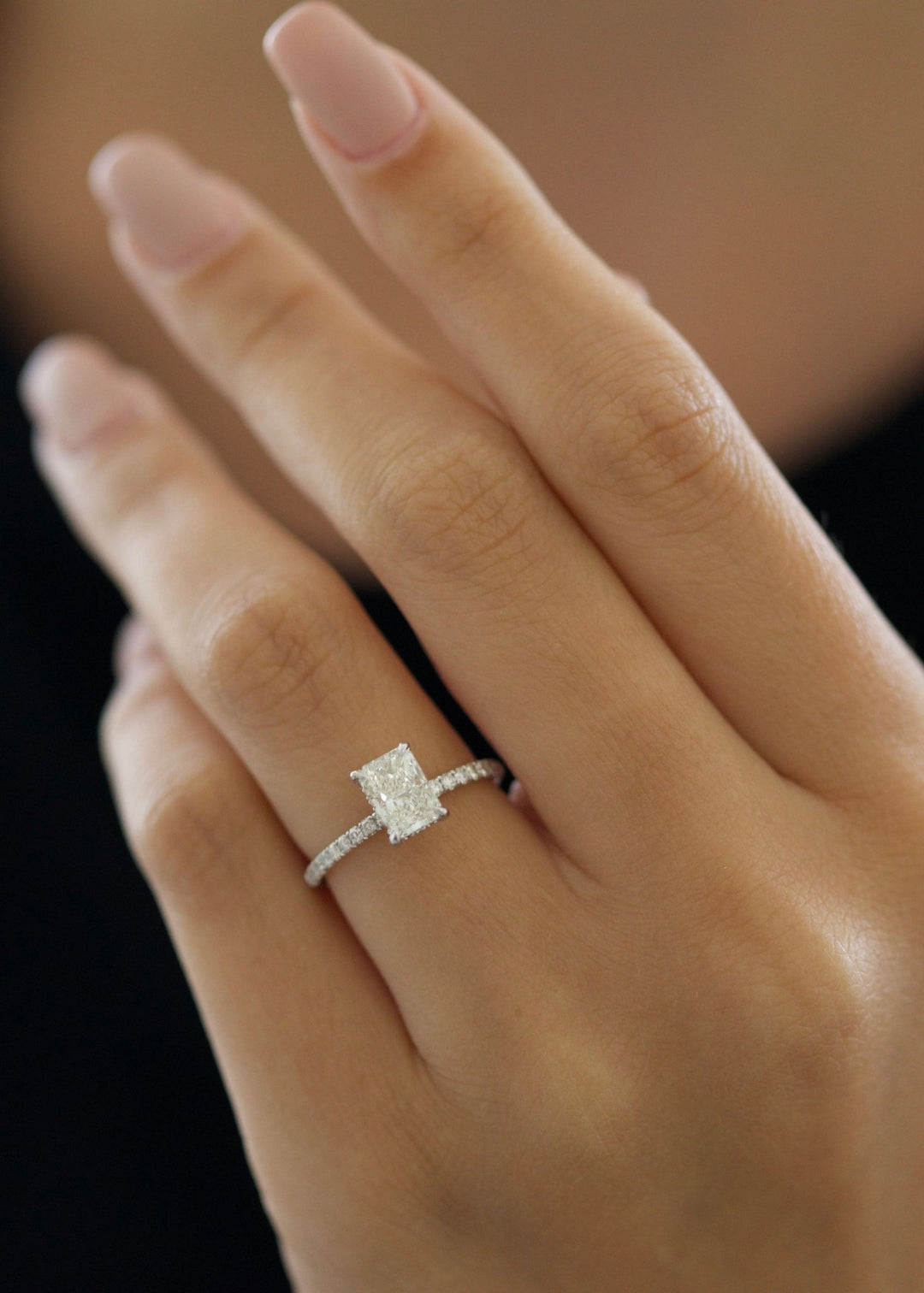 Radiant pave engagement ring close-up showing G-VS2 diamond clarity