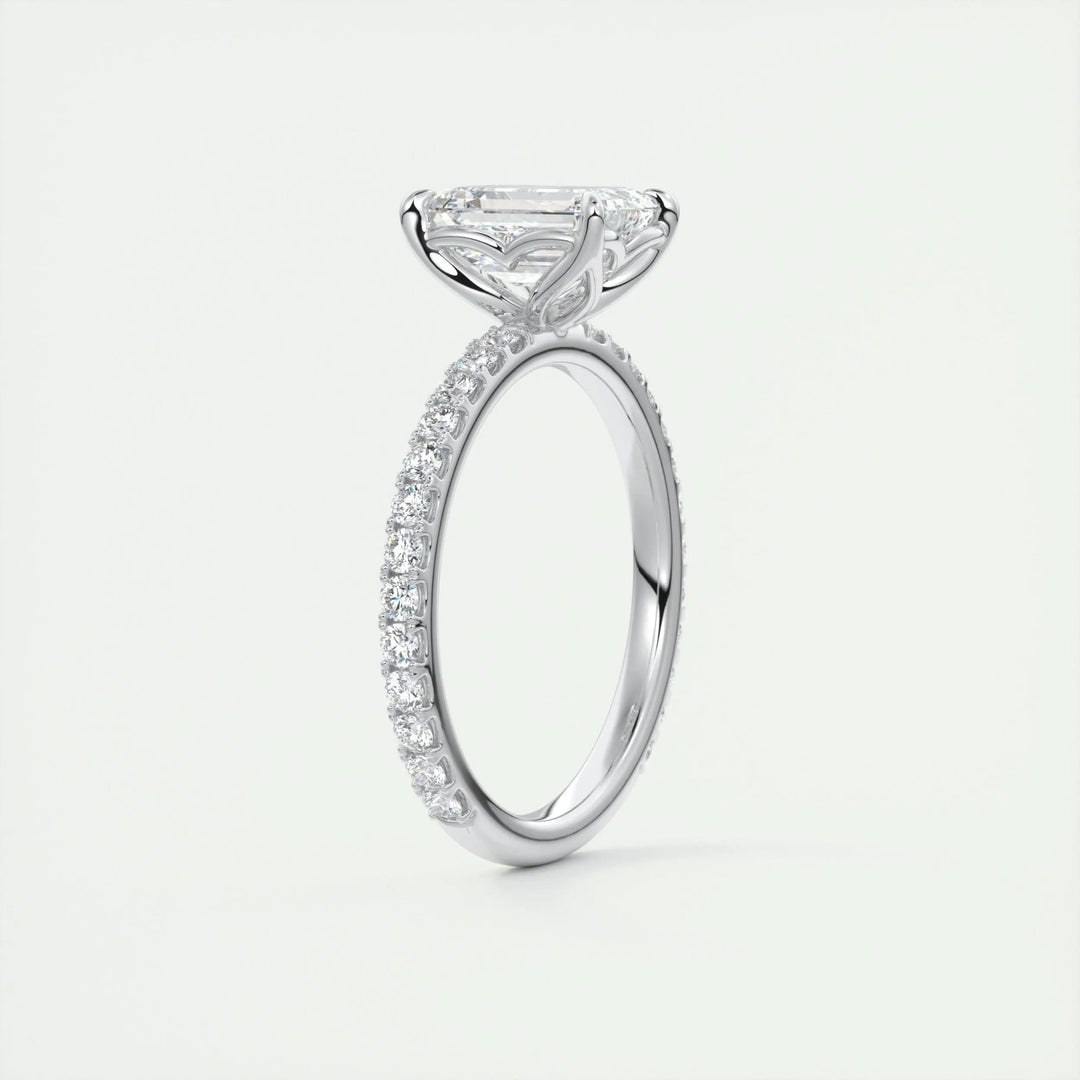 Detailed close-up of emerald pave diamond engagement ring