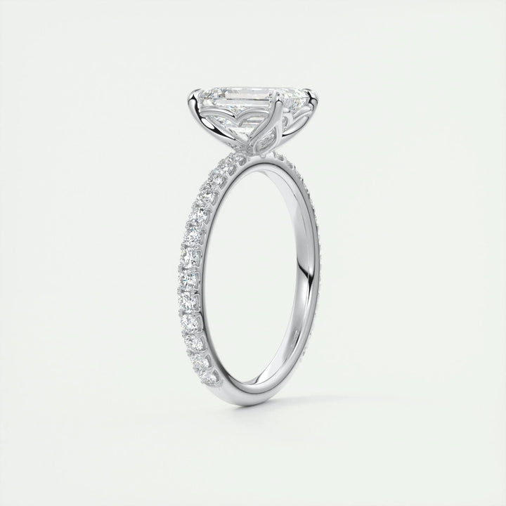 Detailed close-up of emerald pave diamond engagement ring