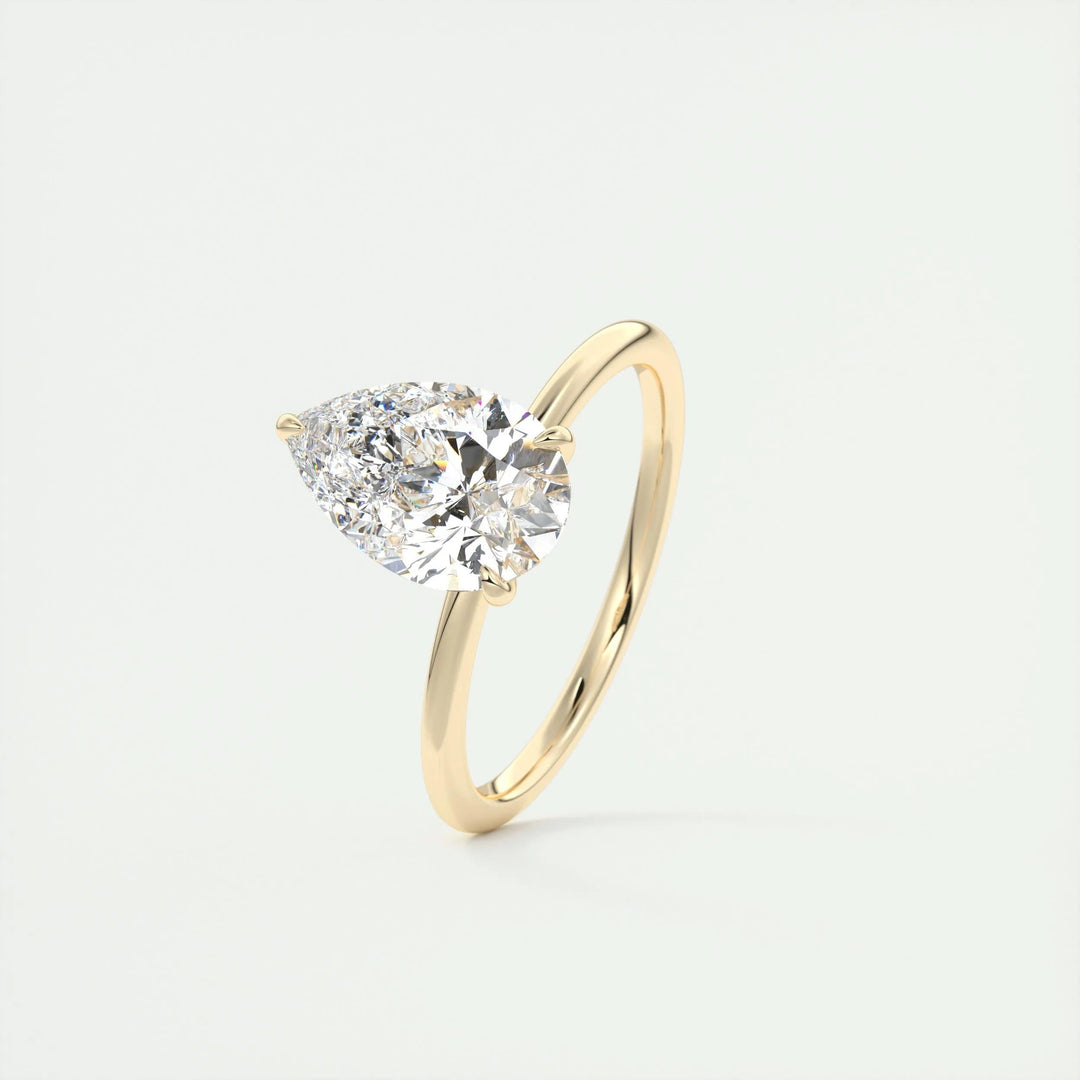 Pear solitaire engagement ring viewed from the side