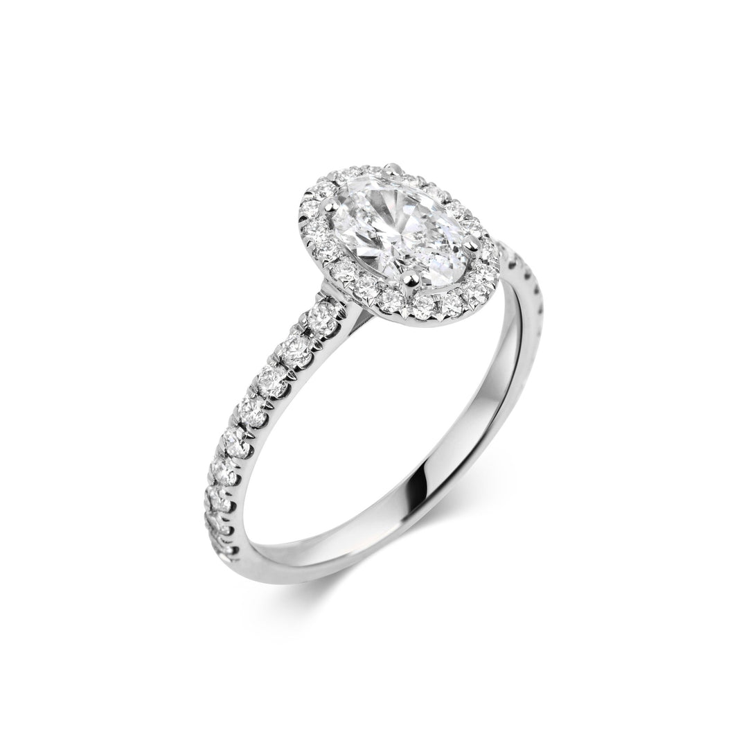 Oval pave diamond ring displayed on jewelry stand