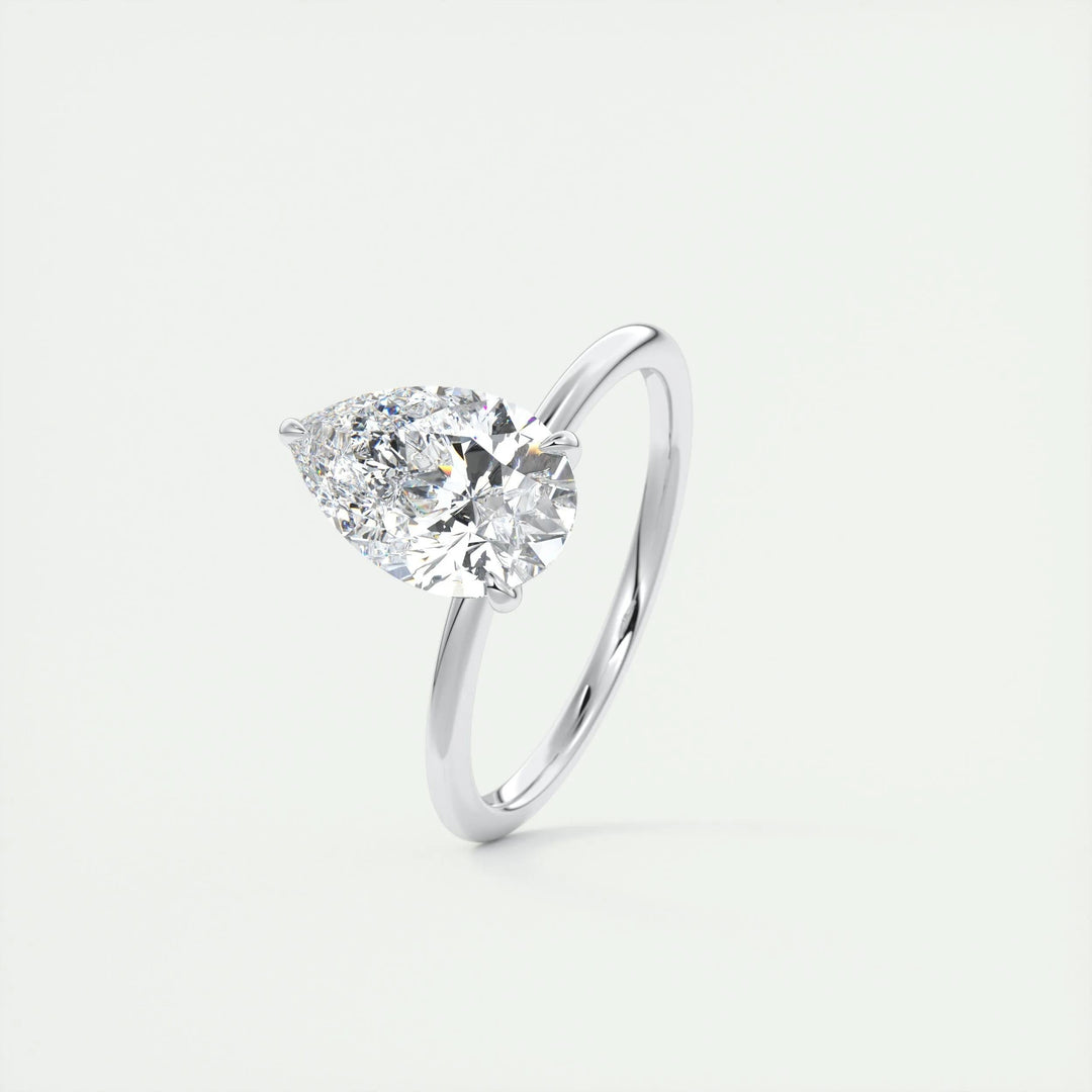 Close-up of pear cut center diamond in solitaire engagement ring