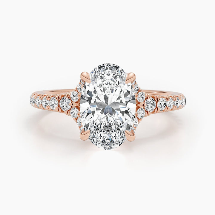Angled view of oval cut diamond in cluster setting