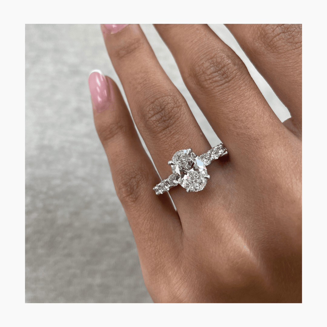 Detailed close-up of oval pave diamond engagement ring