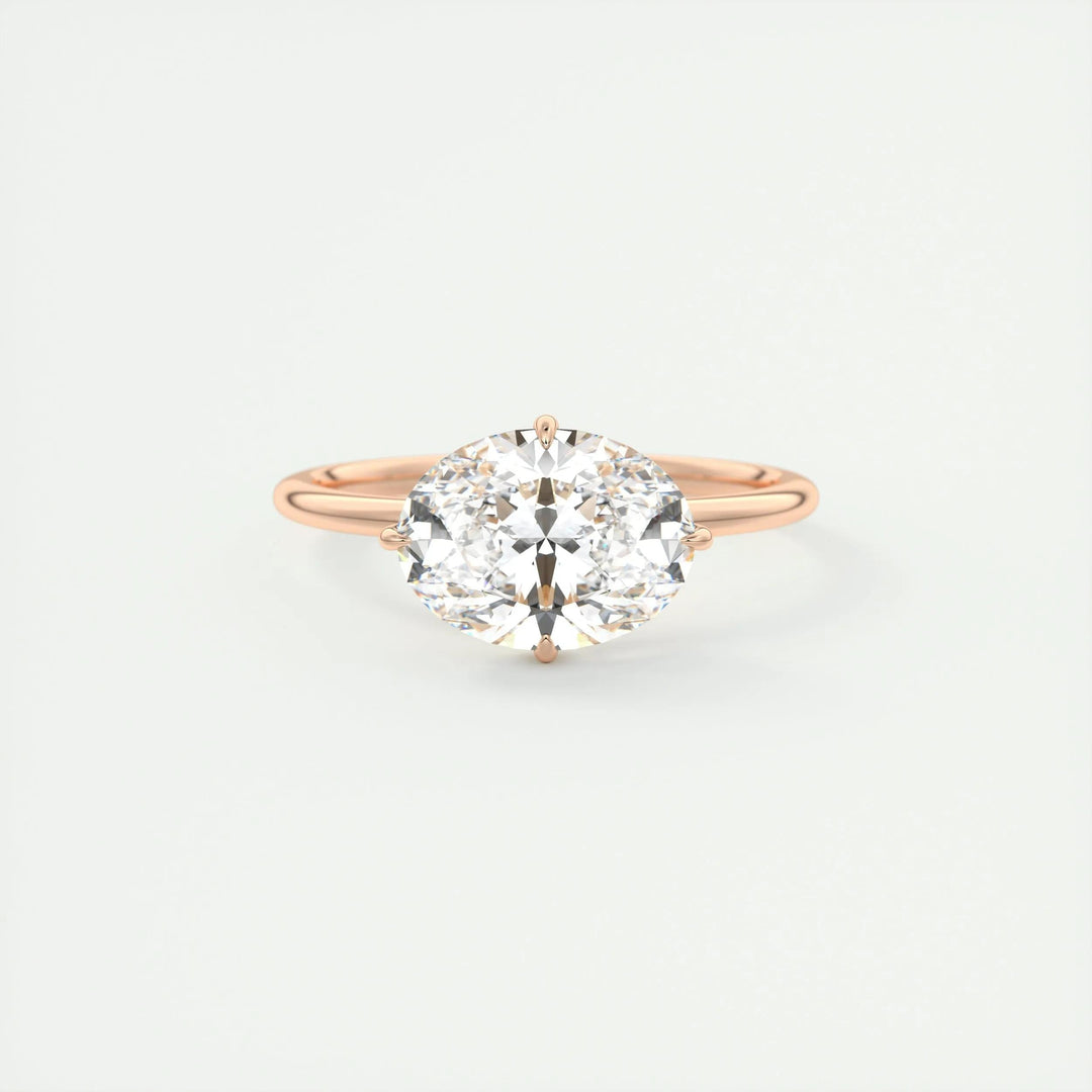 Oval hidden halo engagement ring photographed in natural light