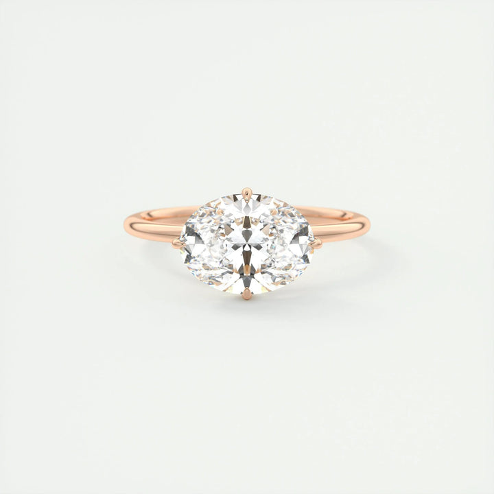 Oval hidden halo engagement ring photographed in natural light