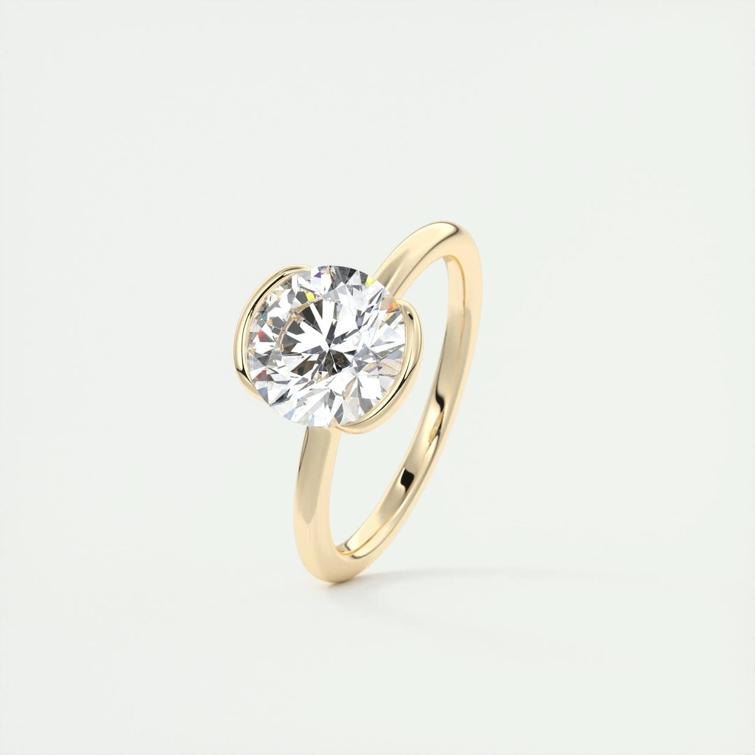 Round solitaire engagement ring viewed from the side