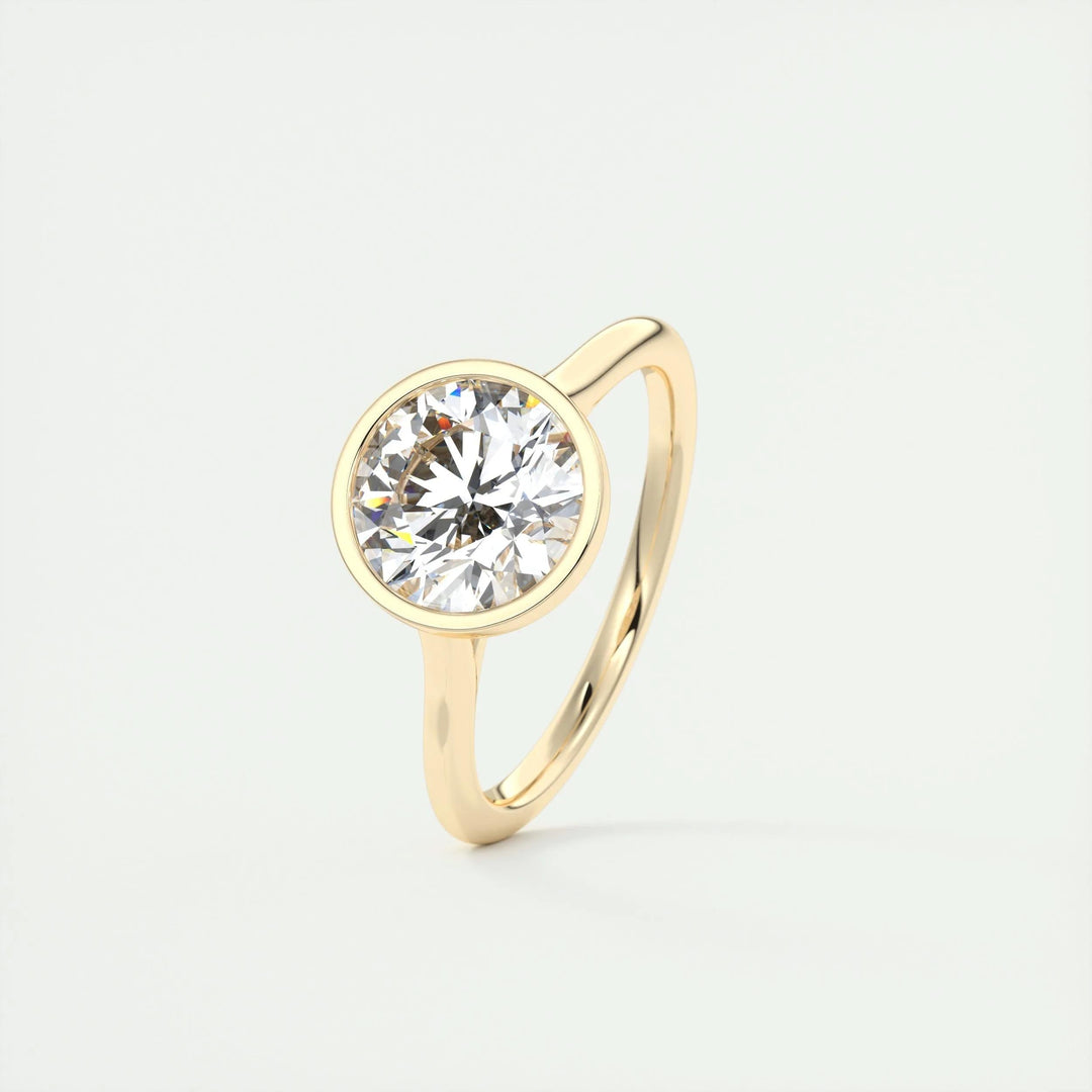 Macro shot of round cut diamond facets in bezel ring setting