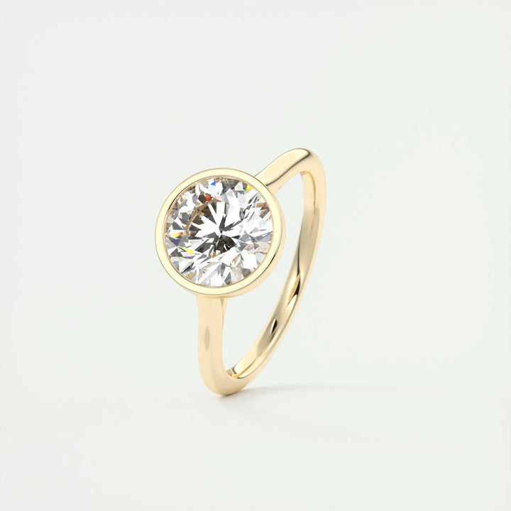 Macro shot of round cut diamond facets in bezel ring setting