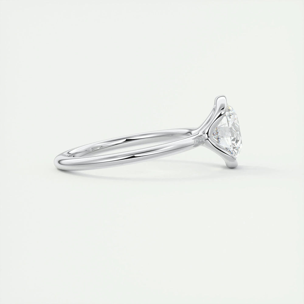 Round solitaire engagement ring close-up showing F-/VS1 diamond clarity