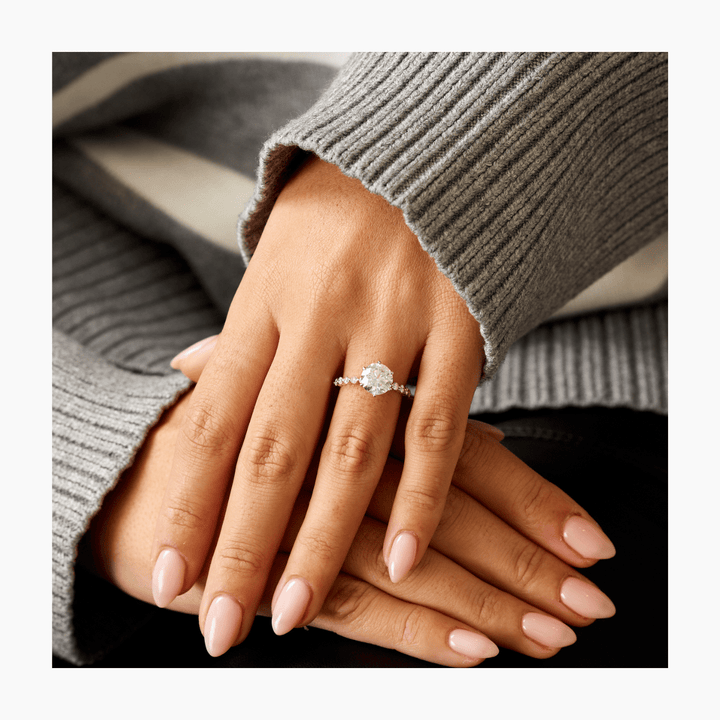 Top-down view of round cut pave engagement ring