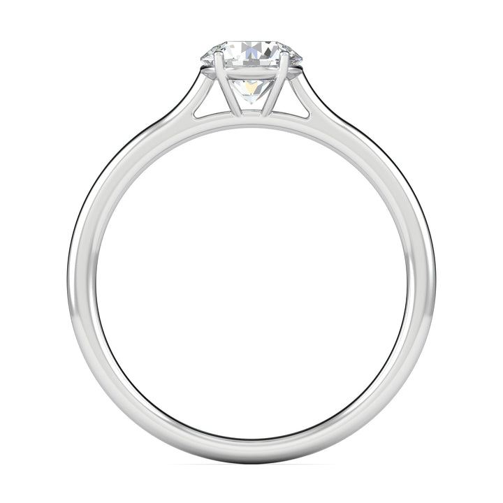 Round solitaire diamond ring displayed on jewelry stand