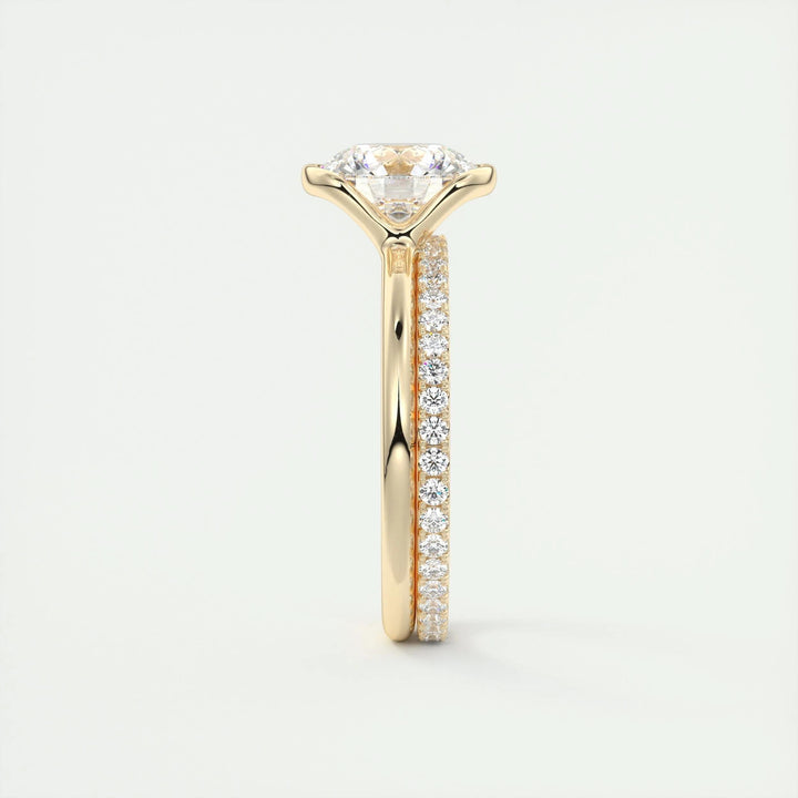Round solitaire engagement ring shown on hand for true-to-life sizing