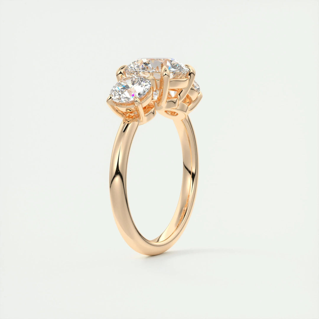 Macro shot of round cut diamond facets in three stone ring setting