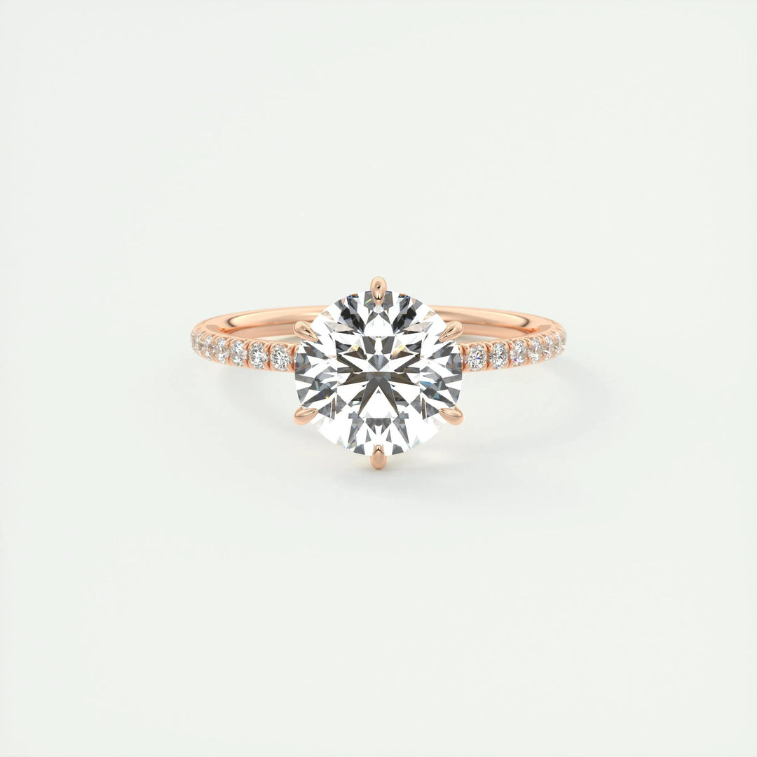 Close-up of round cut center diamond in pave engagement ring