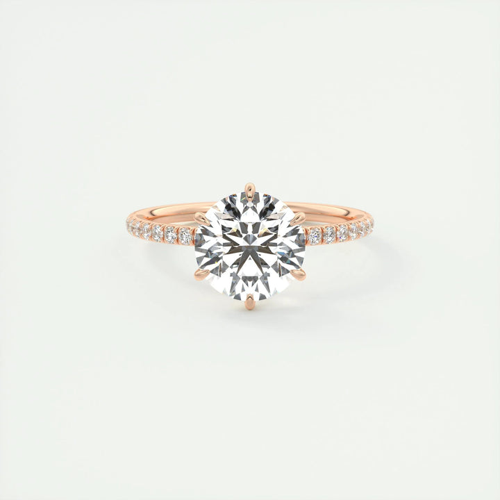 Close-up of round cut center diamond in pave engagement ring