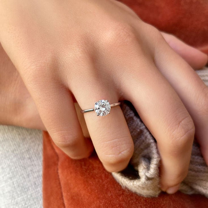 Profile view of round cut solitaire engagement ring band