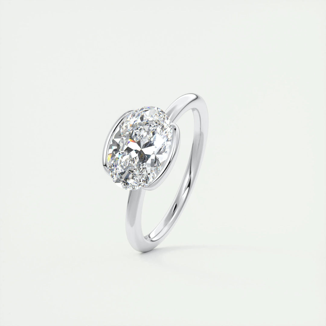 Certified oval cut diamond featured in bezel engagement ring