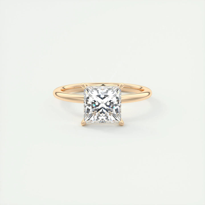 Lifestyle shot of princess solitaire diamond ring on hand