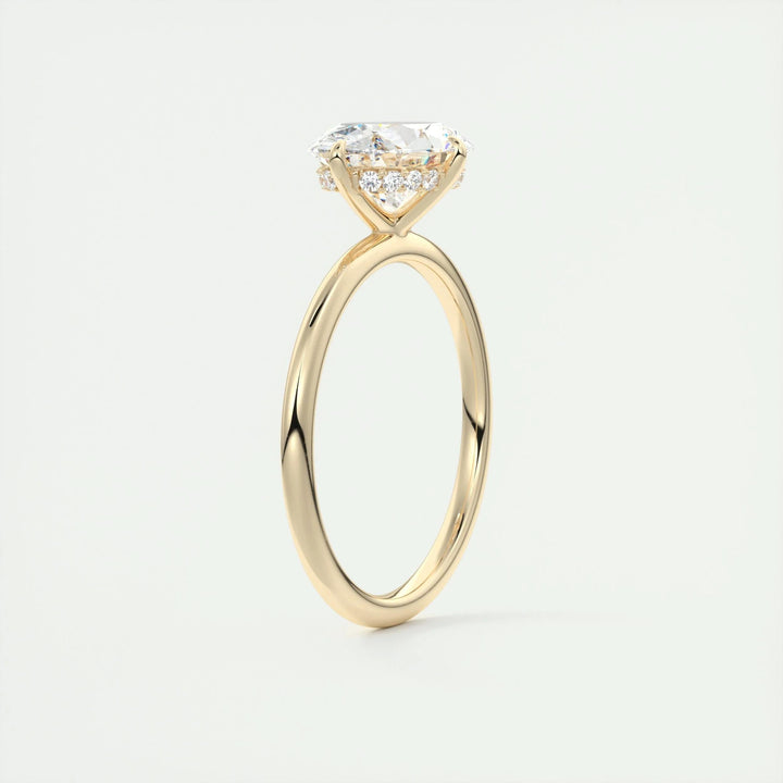 Fine craftsmanship detail on oval hidden halo engagement ring