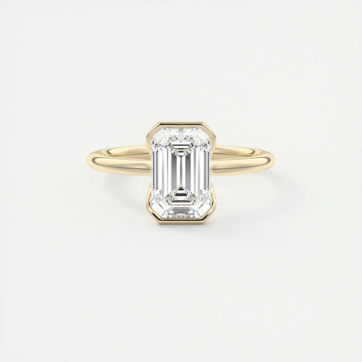 Angled view of emerald cut diamond in solitaire setting