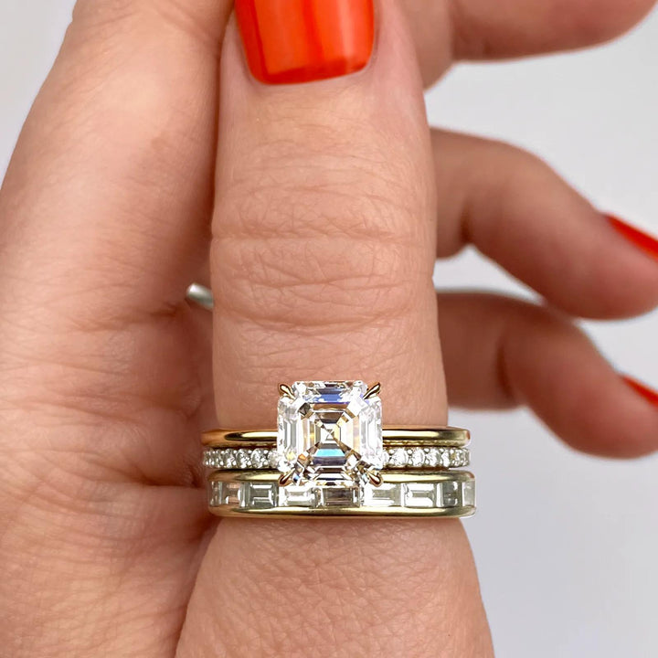 Asscher cut engagement ring shown with authenticity certificate