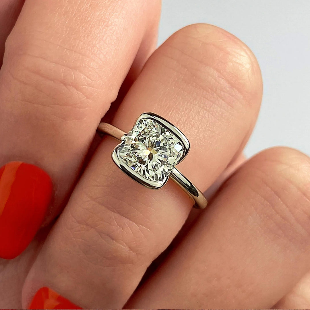 Cushion cut diamond ring worn on hand