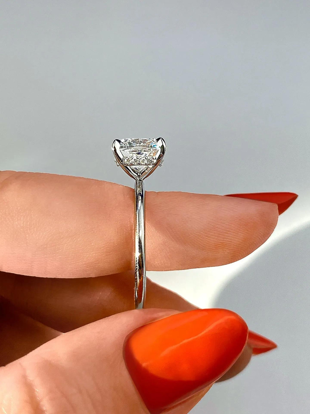 Cushion hidden halo engagement ring close-up highlighting diamond sparkle