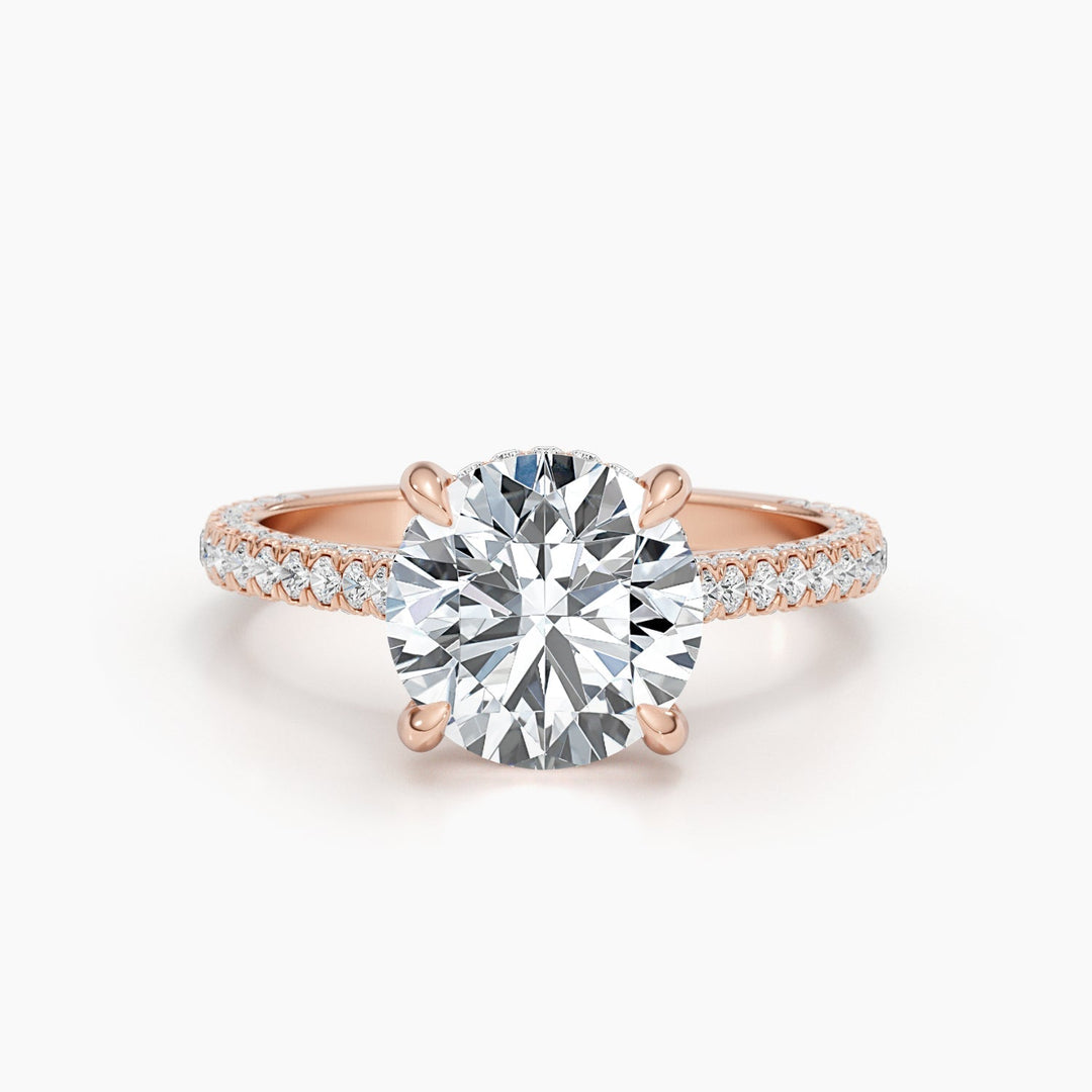 Close-up of round cut center diamond in hidden halo engagement ring