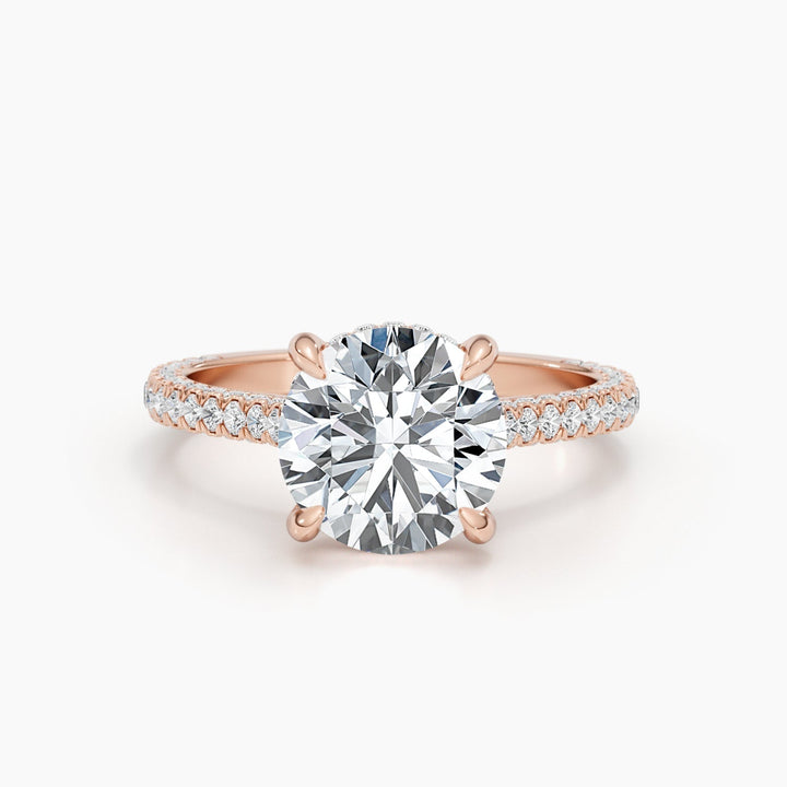 Close-up of round cut center diamond in hidden halo engagement ring