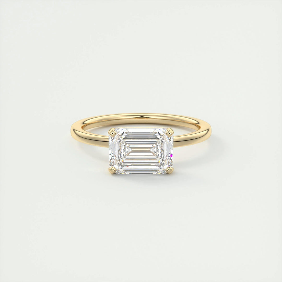 Certified emerald cut diamond featured in east west engagement ring