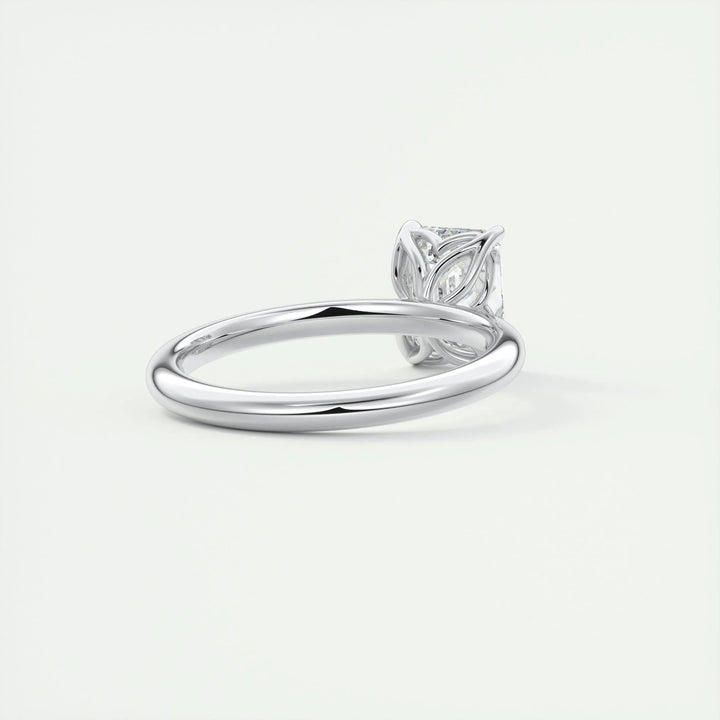 Detailed close-up of emerald solitaire diamond engagement ring