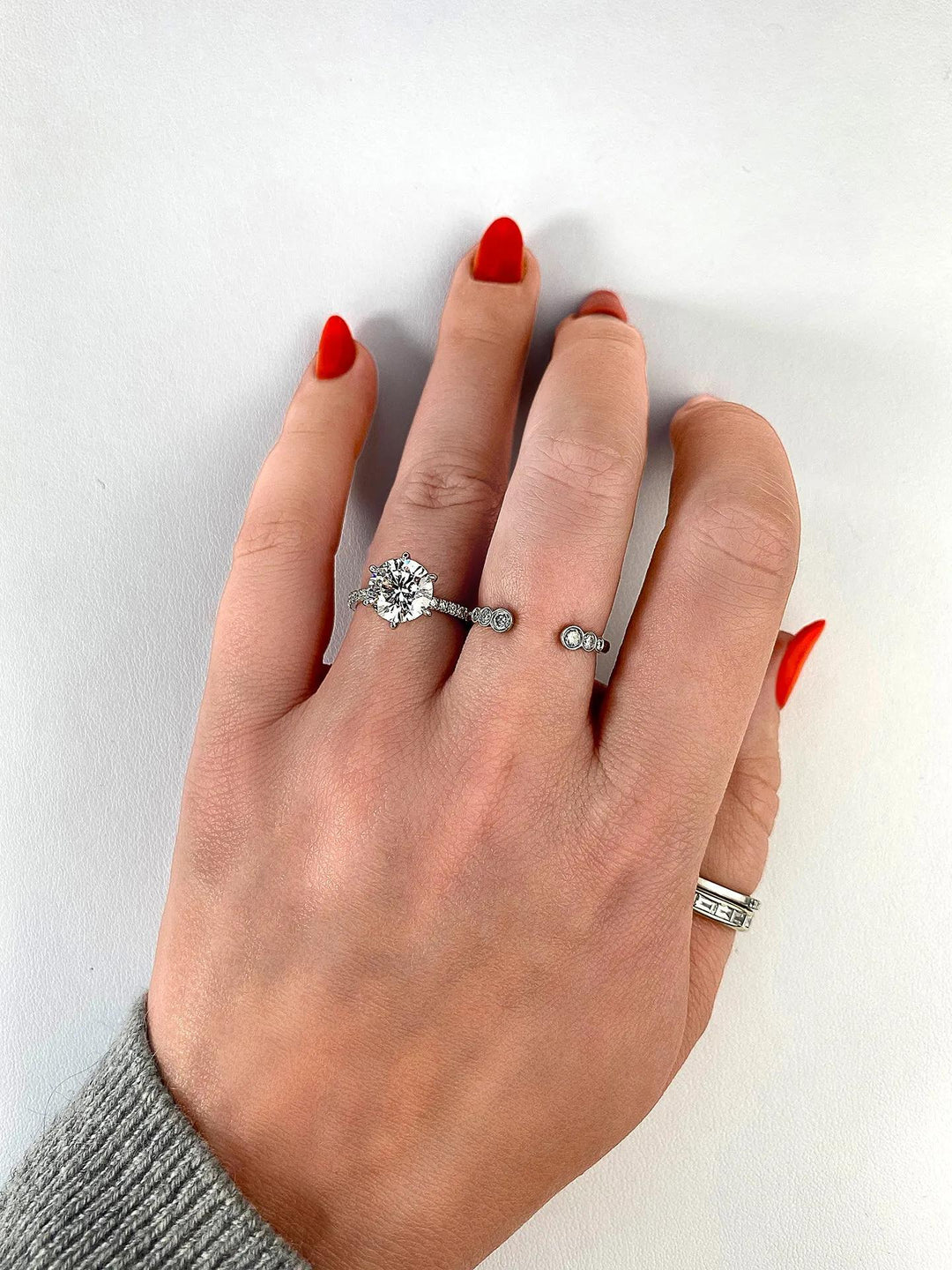 Round pave engagement ring viewed from the side