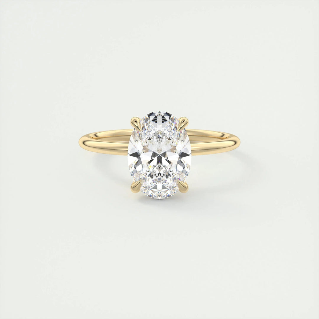 Oval hidden halo diamond ring displayed on jewelry stand
