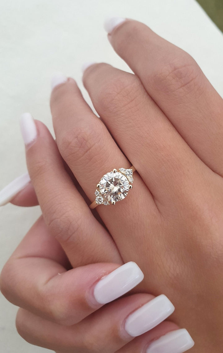Round cluster lab grown diamond ring fitted on finger