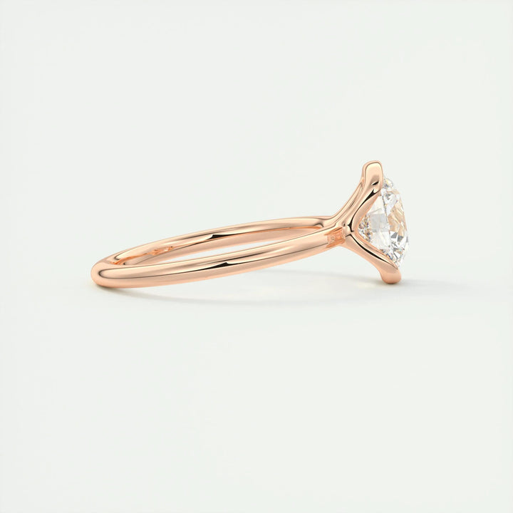 Round cut solitaire engagement ring shown in real-life wear