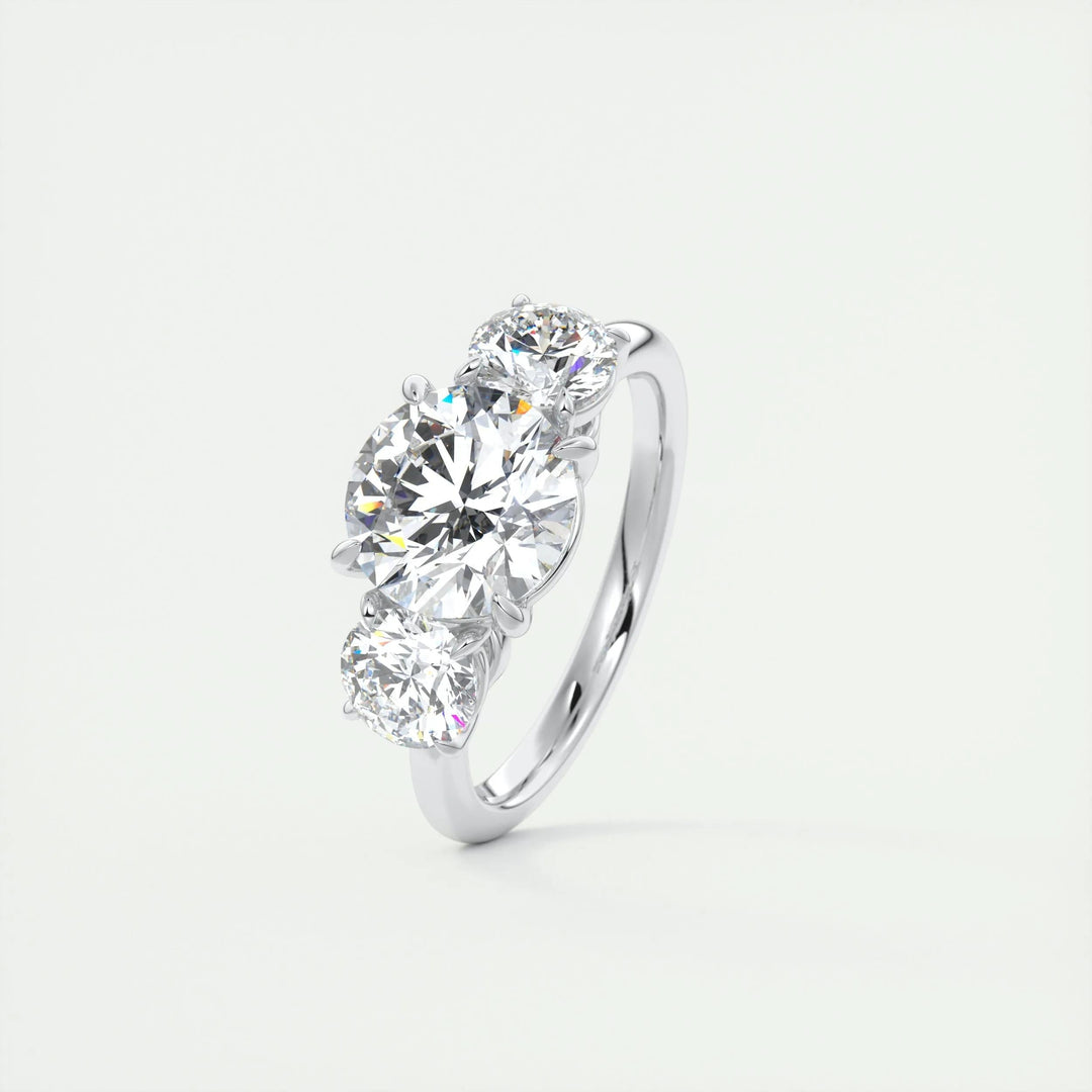Unboxing view of round cut three stone diamond engagement ring