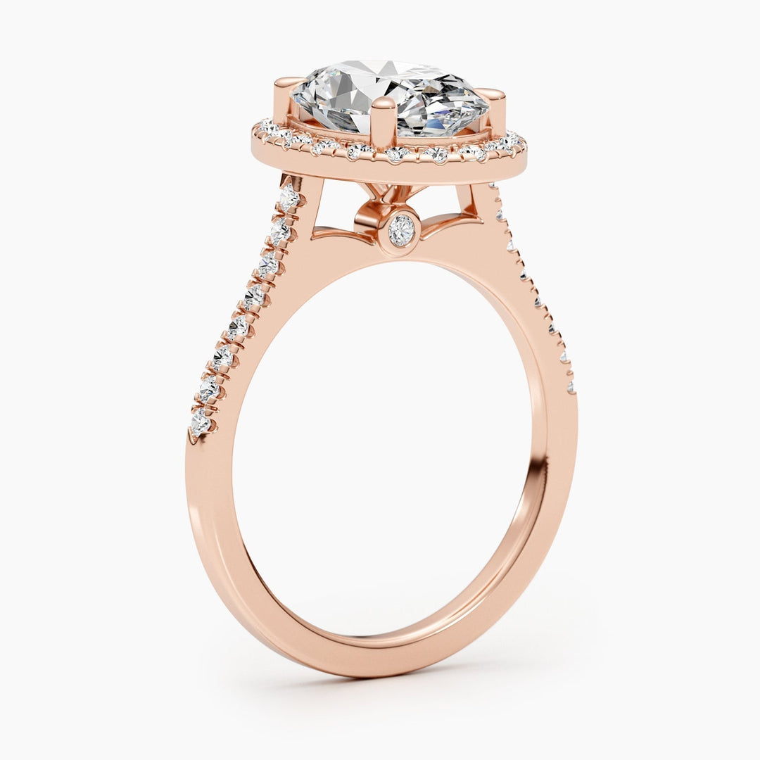 Profile view of oval cut halo engagement ring band
