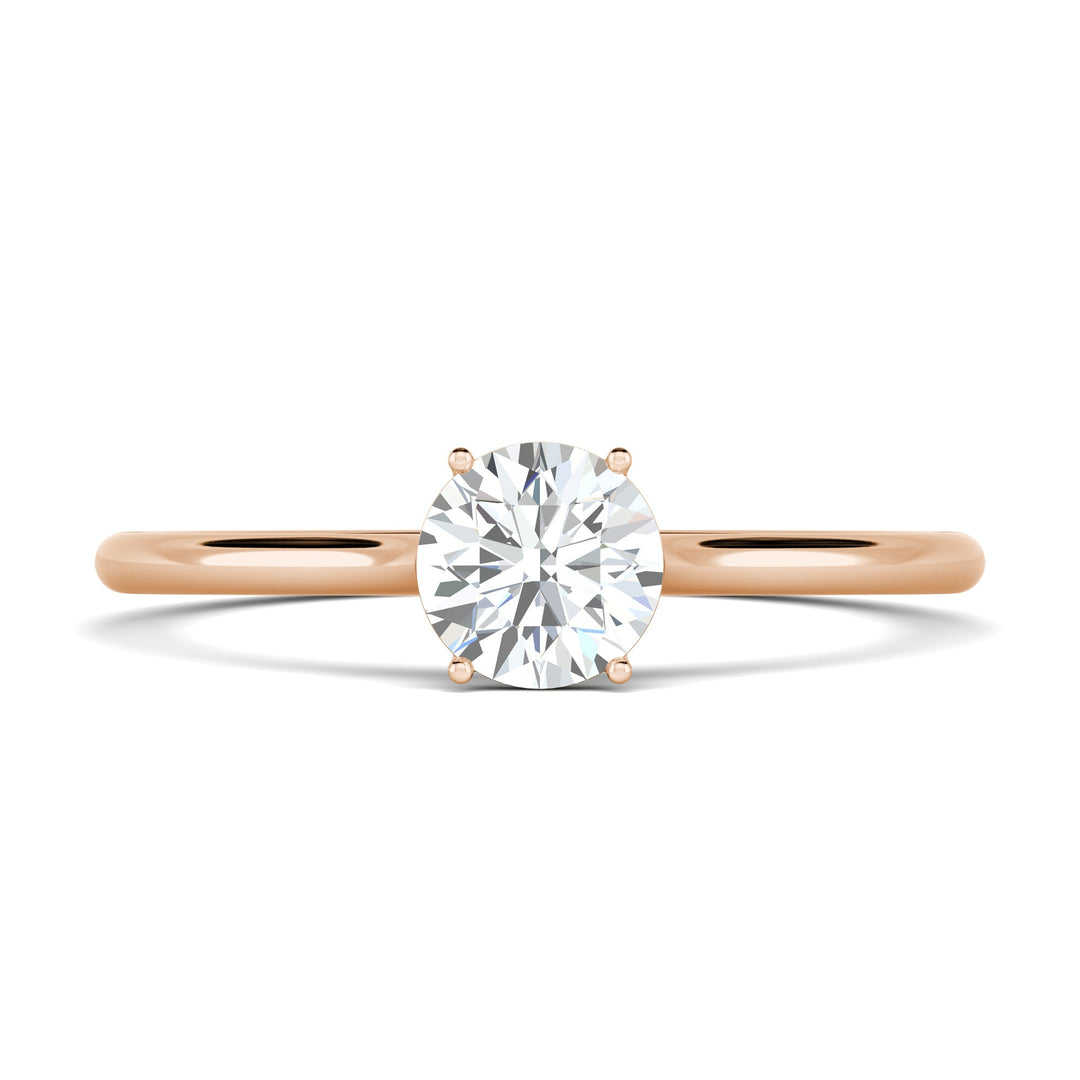 Round solitaire engagement ring close-up highlighting diamond sparkle