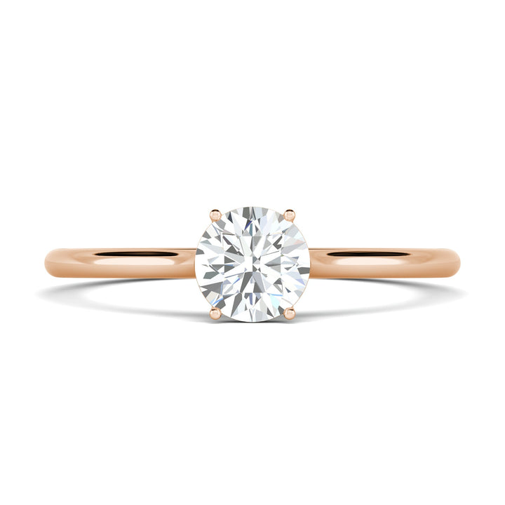 Round solitaire engagement ring close-up highlighting diamond sparkle
