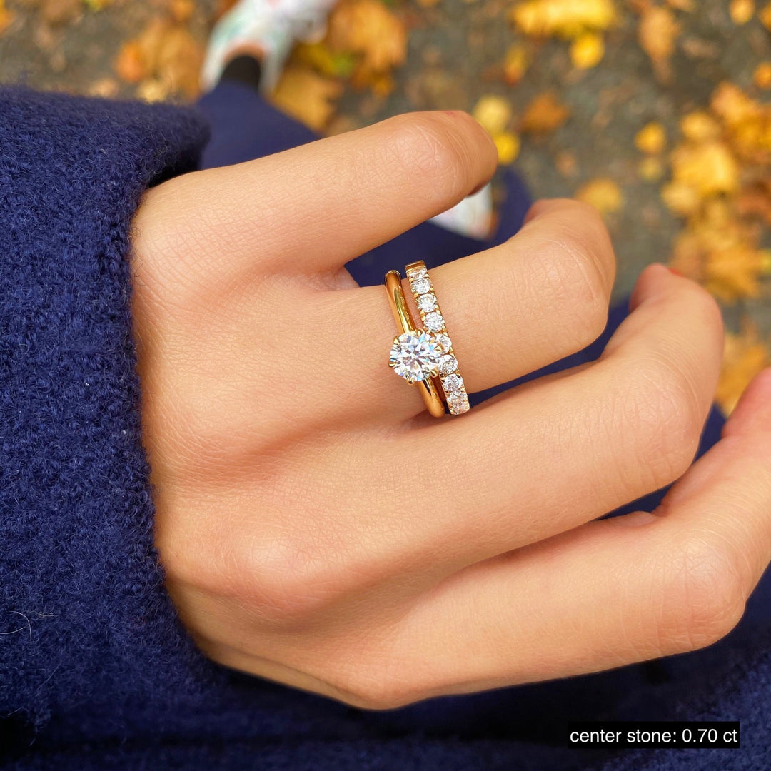 Round solitaire engagement ring photographed in natural light