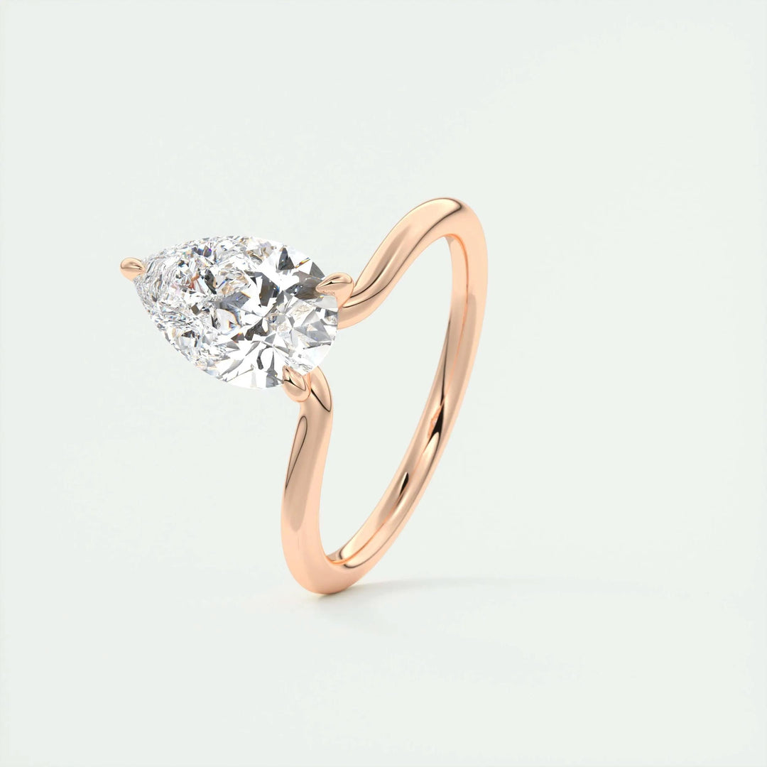 Pear solitaire engagement ring shown on hand for true-to-life sizing