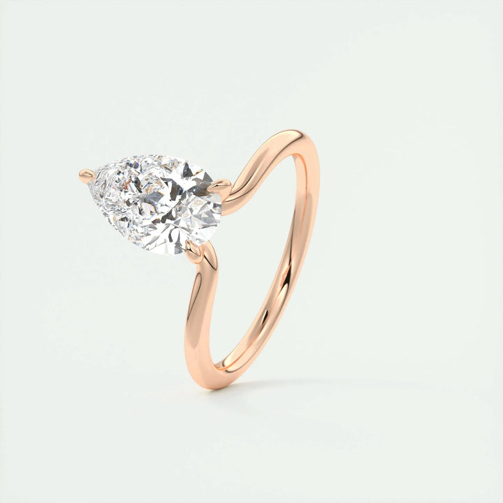 Pear solitaire engagement ring shown on hand for true-to-life sizing