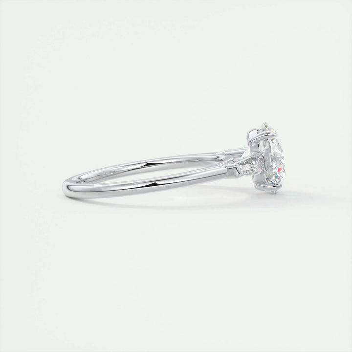 Top-down view of round cut three stone engagement ring