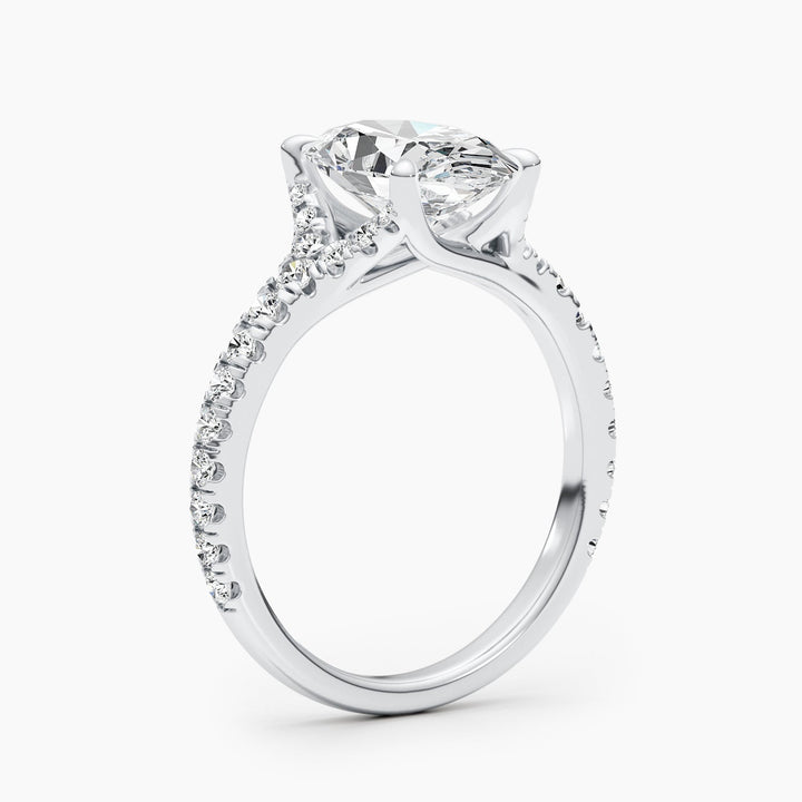 Oval cluster engagement ring photographed in natural light